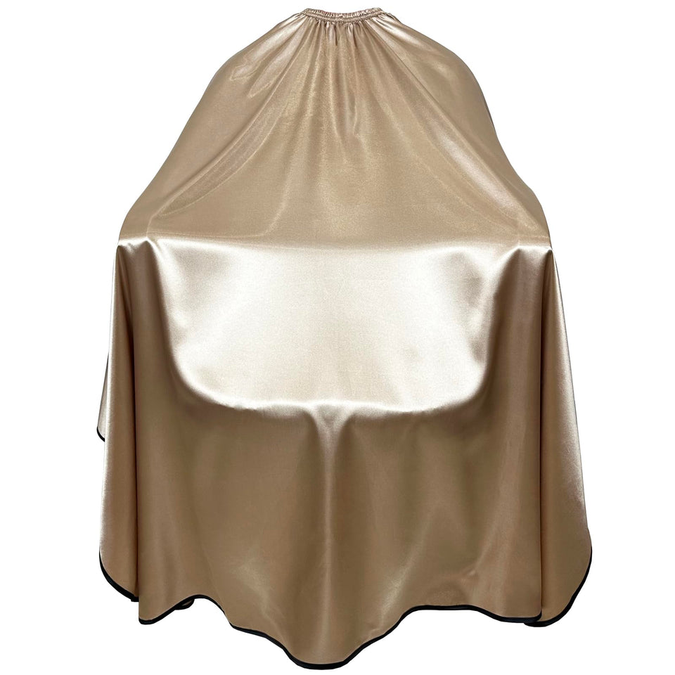 Pelocapa satin cape close-up showing waterproof fabric and soft texture for client comfort.