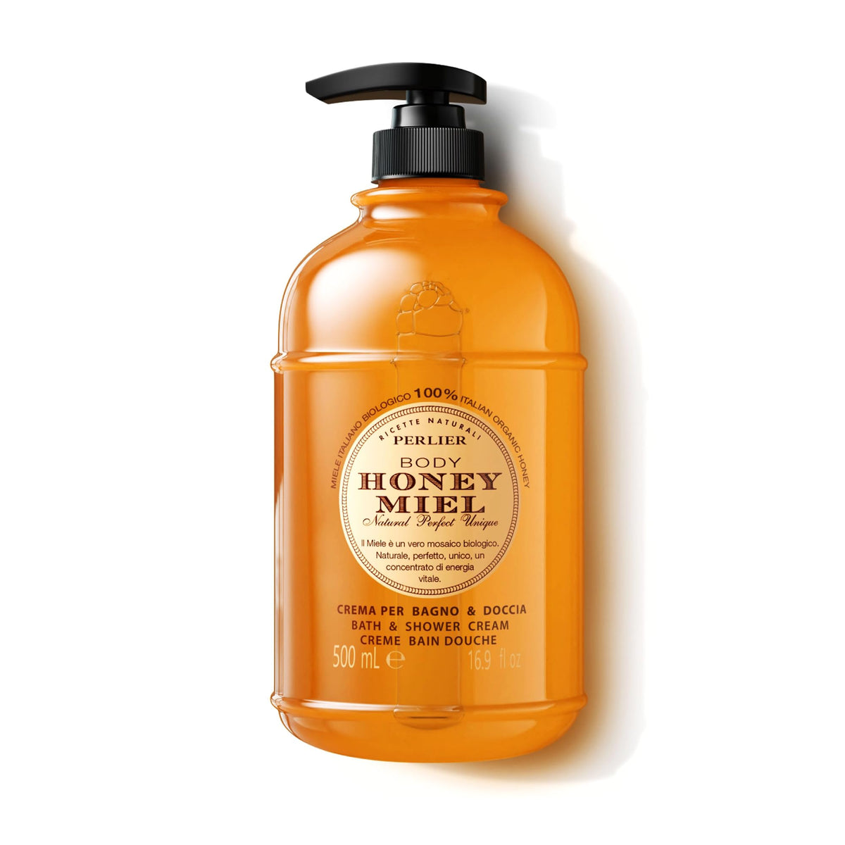 Perlier Honey Bath Cream bottle on a bathroom shelf suggesting silky skin benefits