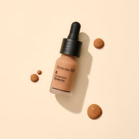 Perricone MD No Makeup Bronzer swirled onto skin as a sheer veil.