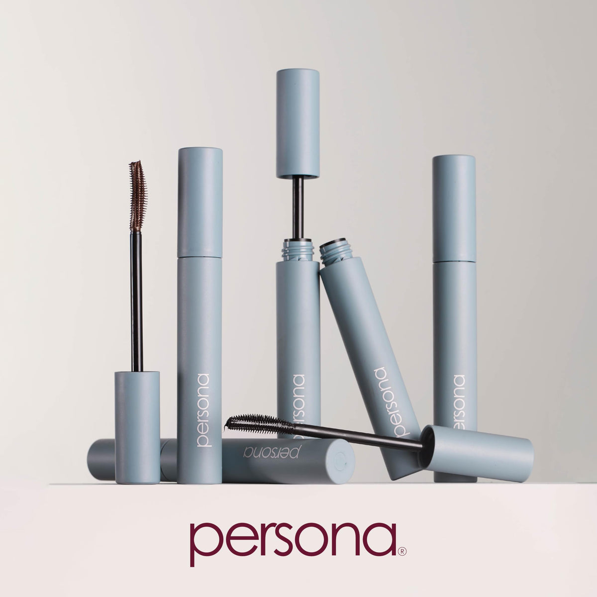PERSONA mascara wand close-up shows curved design for lift.