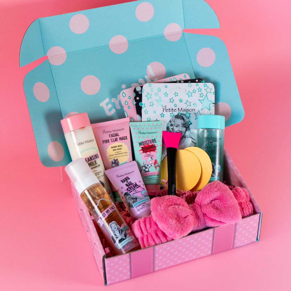 Petite Maison skincare collection close-up with tubes and jars for daily routine.
