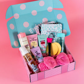 Petite Maison skincare collection close-up with tubes and jars for daily routine.