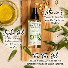 PHARM TO TABLE Tea Tree Hair Oil dropper close-up for scalp care.