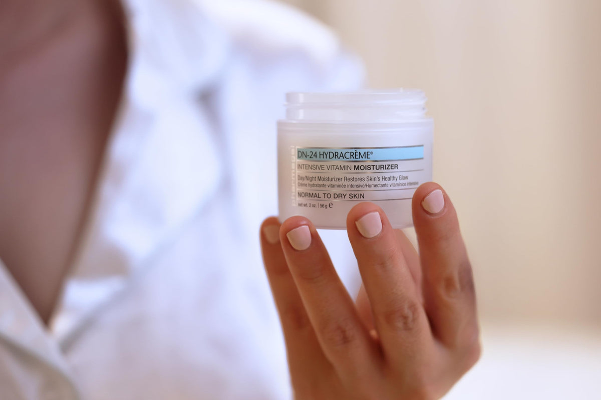 Pharmagel DN-24 Hydracrème applied to neck during routine for hydration.