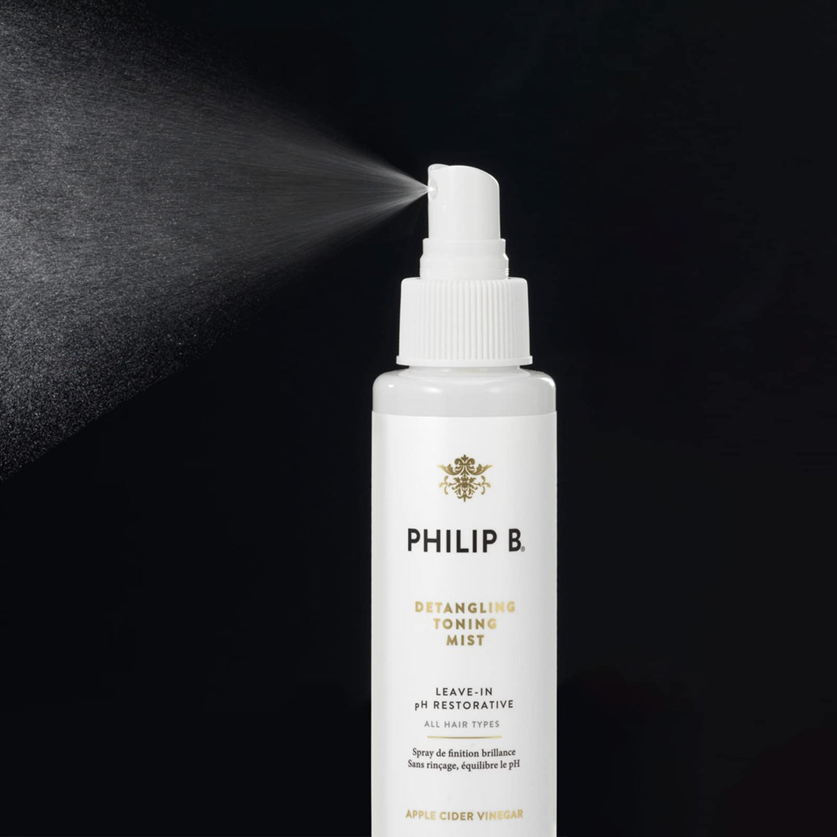 PHILIP B Detangling Toning Mist on wet hair seals cuticles for smoothness.