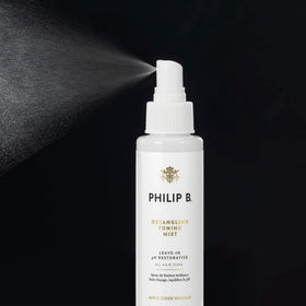 PHILIP B Detangling Toning Mist on wet hair seals cuticles for smoothness.