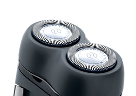 Two AA batteries included with the Philips Norelco travel shaver.