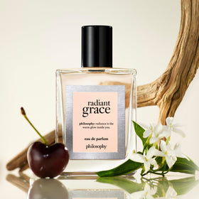 Philosophy Radiant Grace caramel sandalwood base for lasting warmth.
