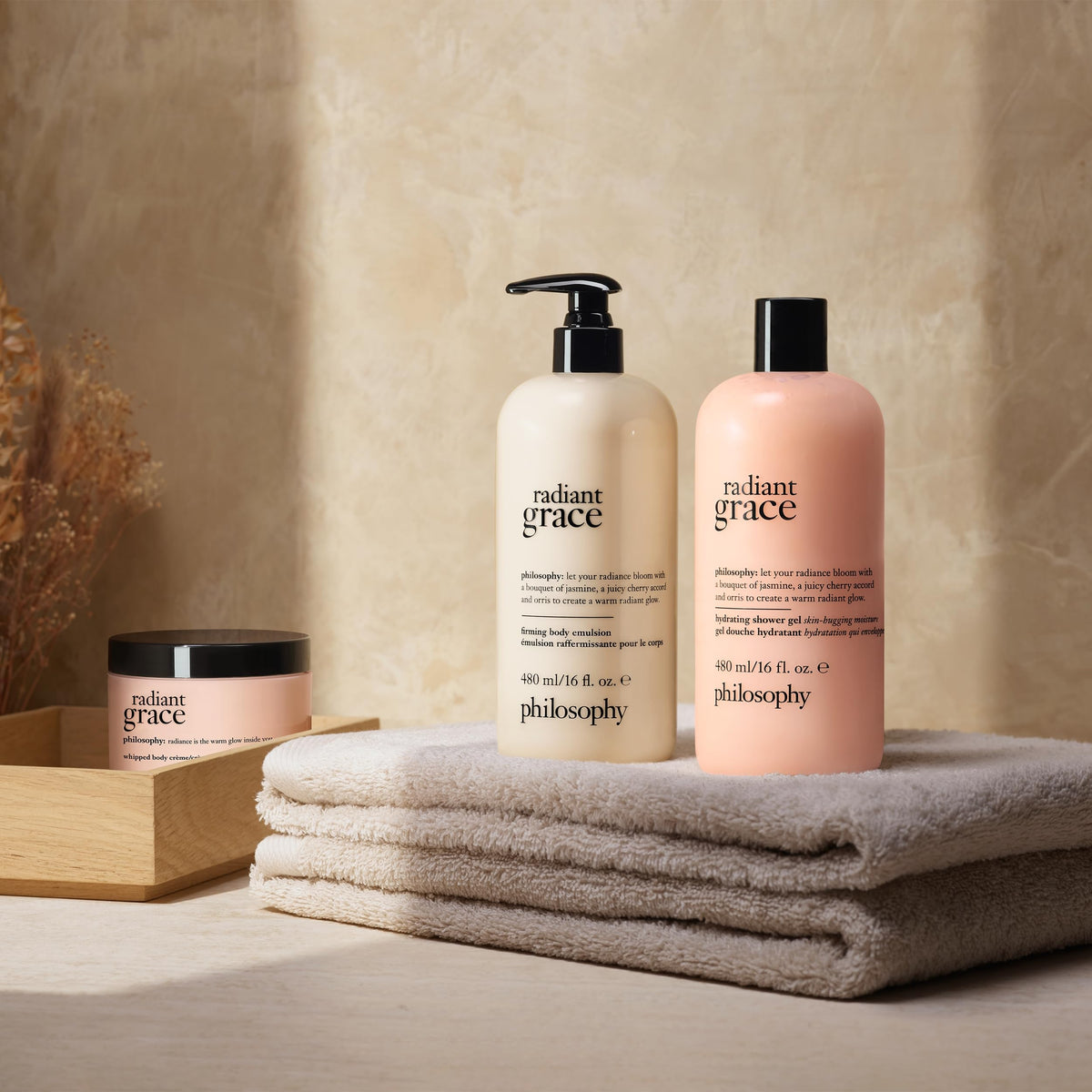 Philosophy Radiant Grace sandalwood warmth, amber finish enhances comforting skin feel.