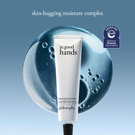 Philosophy unscented hand cream being squeezed to moisturize skin
