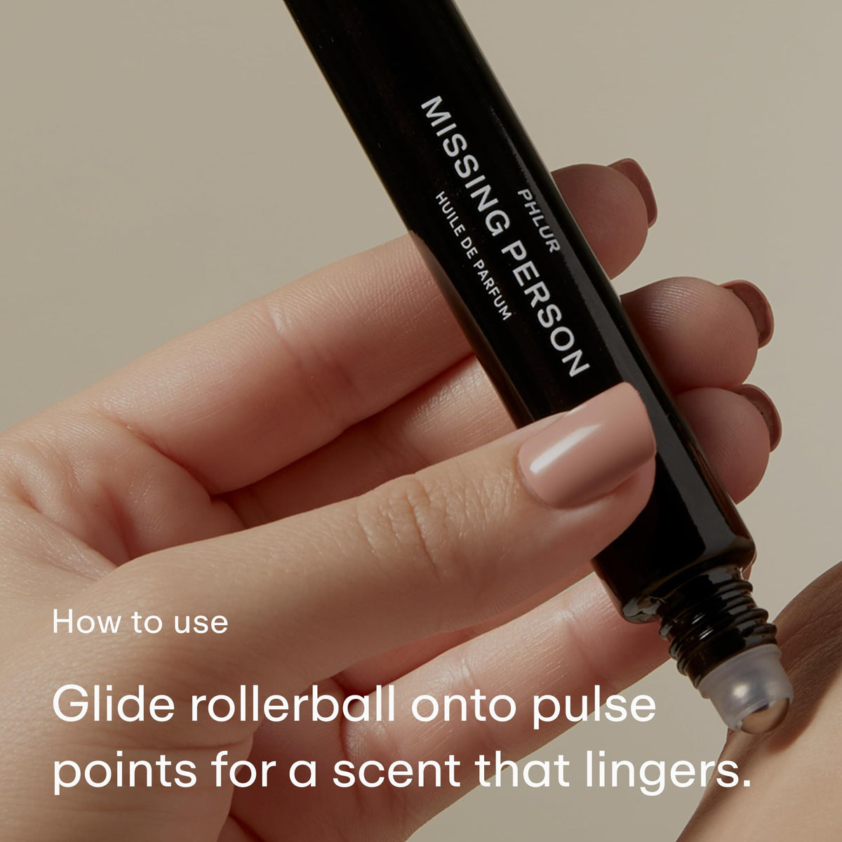 PHLUR Missing Person rollerball application on pulse point for lasting impression