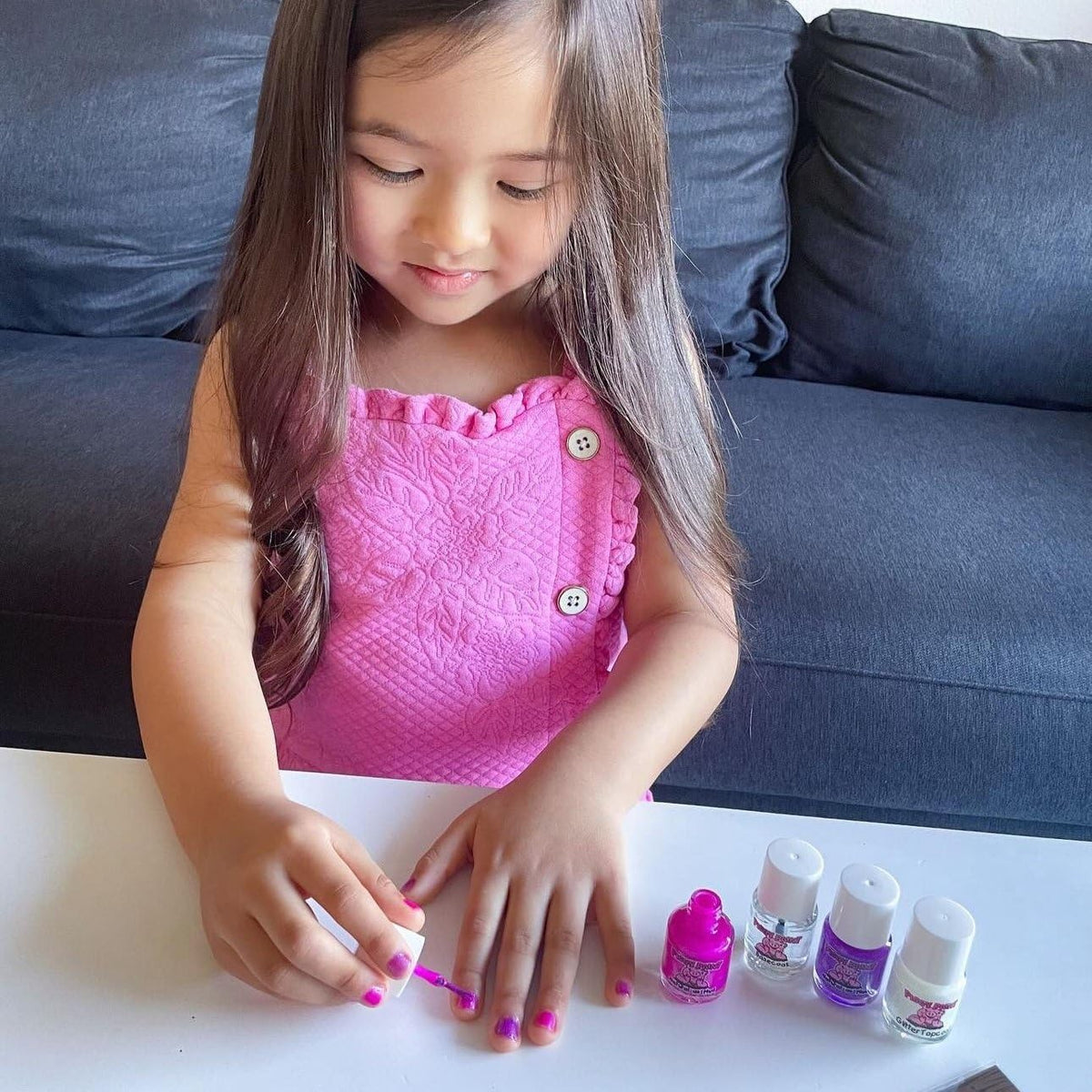 Close-up of Piggy Paint nail polish bottle showing non-toxic formula