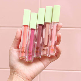 Close-up of Pixi LipLift Max gloss on lips with a shiny finish.