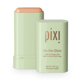 Pixi On-The-Glow solid moisturizer stick in action for quick face application on the go.