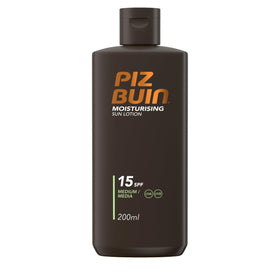 Piz Buin Moisturising Sun Lotion SPF 15 bottle on a sunny beach for everyday protection