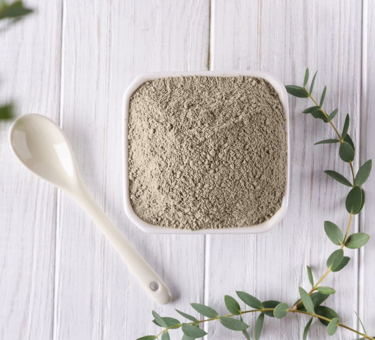 Plant Guru clay paste applied to the face for gentle cleansing and exfoliation.