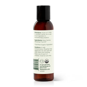 Person applying Plant Therapy Rosehip Oil to facial skin for hydration.