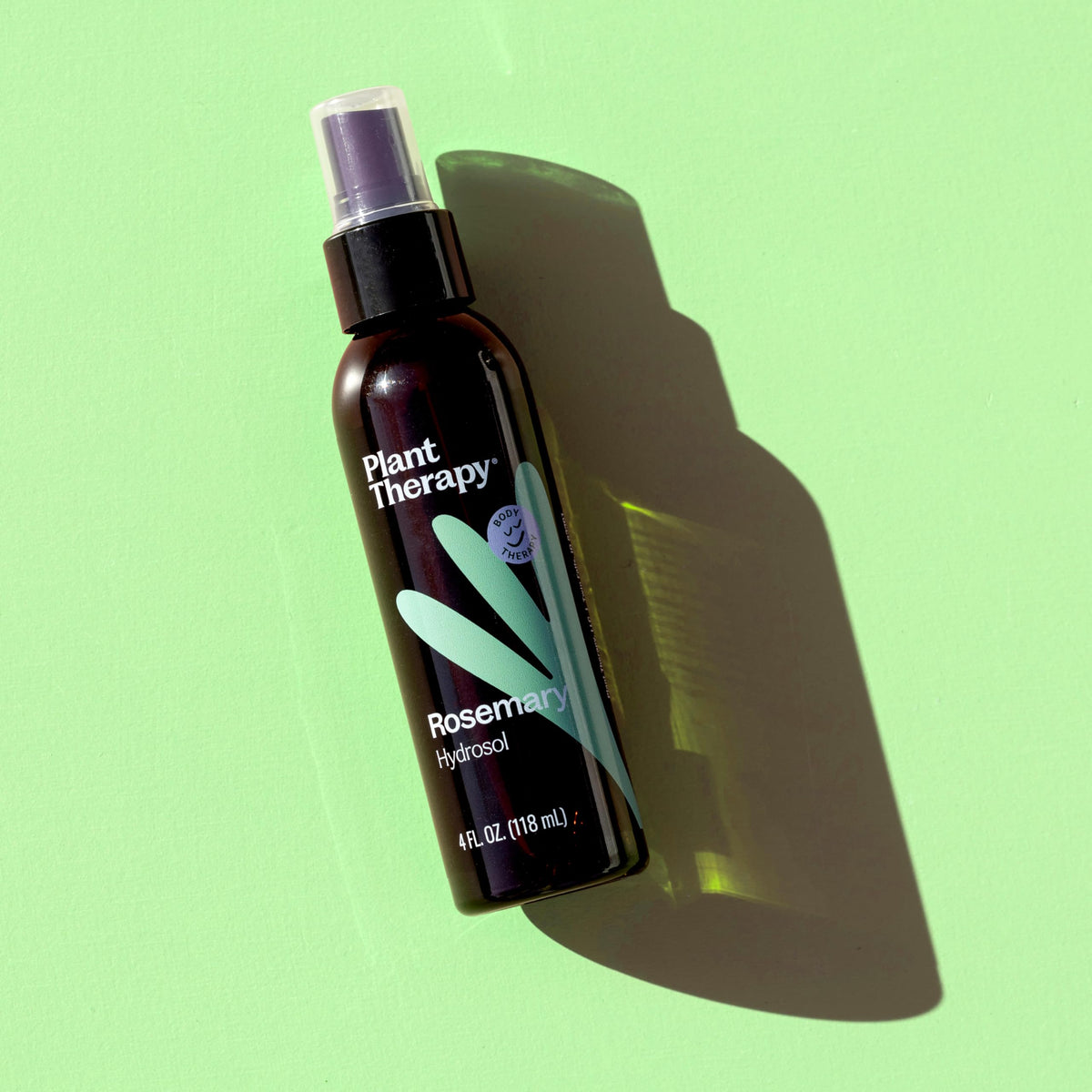 Plant Therapy Rosemary Hydrosol bottle used in bath for a refreshing soak.