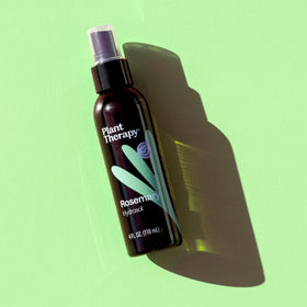 Plant Therapy Rosemary Hydrosol bottle used in bath for a refreshing soak.