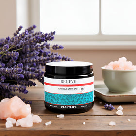 Plantlife Arnica Relieve salts dissolving in warm water for quick, comforting relief.