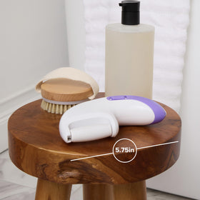 Plum Beauty Automatic Foot File in wet use showing versatile exfoliation during a bath.