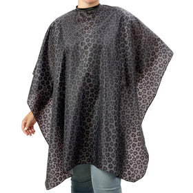 Plum Hill waterproof black leopard cape close-up showing water resistance for salon spills