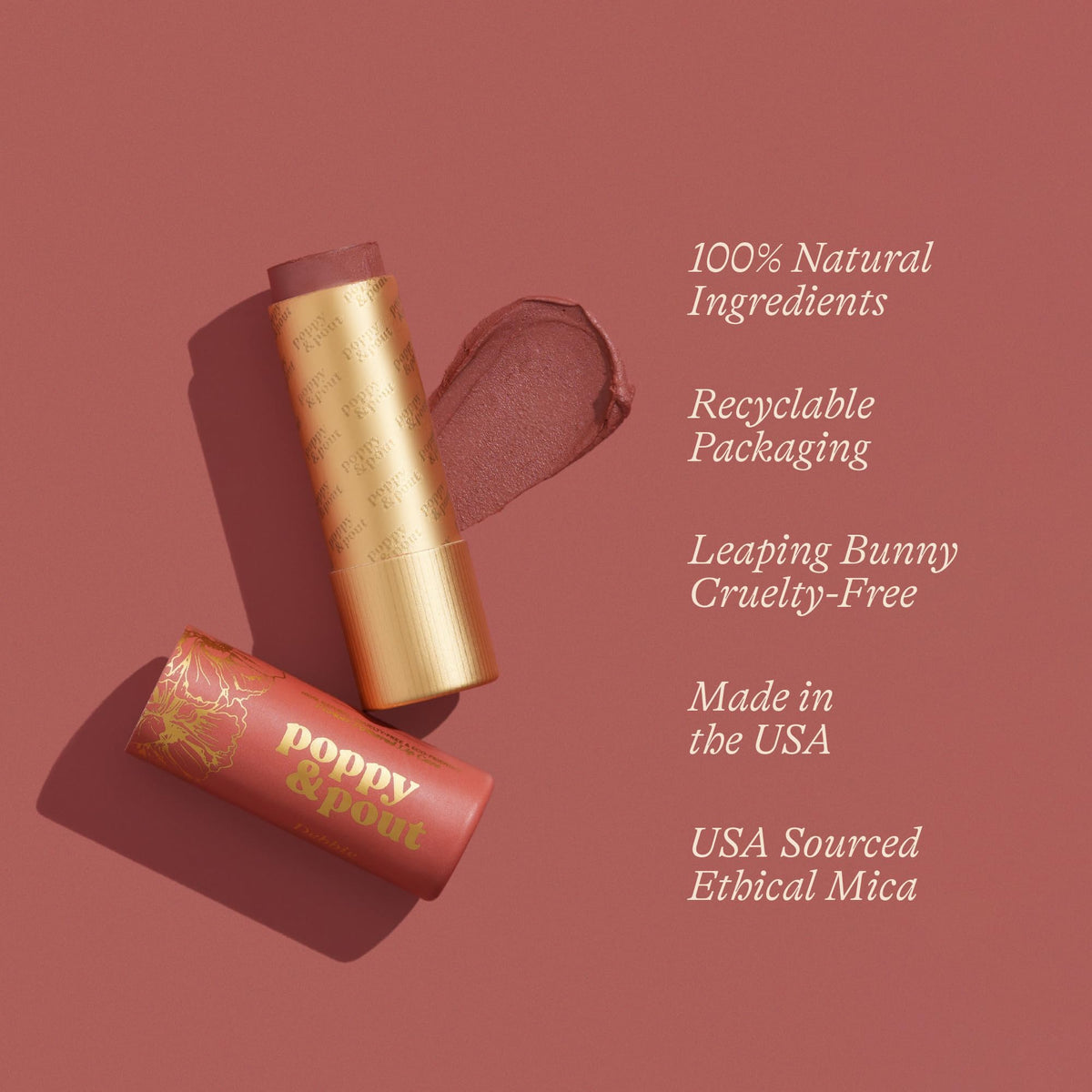 Poppy & Pout Debbie lip tint tube held by hand showing size and application.