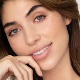 Poppy & Pout Farrah lip tint hand-filled in Idaho, small-batch production detail.