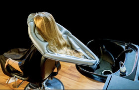 Bedside use with the funnel aiding dry, mess-free rinsing for bedridden clients.