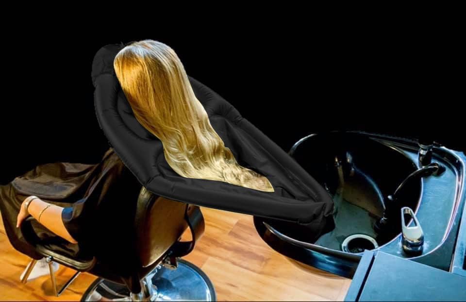 Portabelles cape used on wheelchair users for a tidy hair wash.