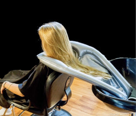 Compact tray setup on a low-back chair for home use.