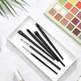 Potchen wooden-handle brush set closeup showcasing ergonomic grip and elegance
