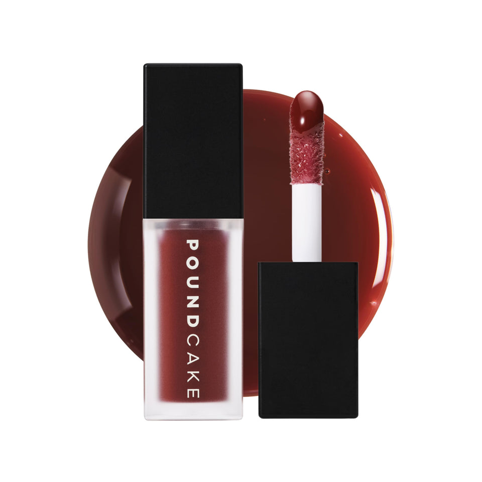 POUND CAKE Cake Theory Lip Tone Equalizing Oil bottle pouring for a smooth, high-gloss lip look