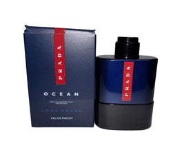 Prada Luna Rossa Ocean premium black packaging on a modern vanity