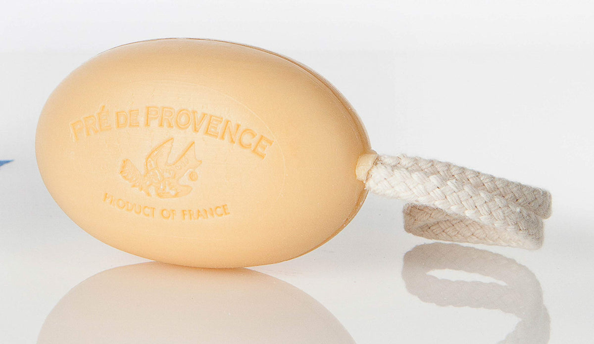 Pre de Provence sandalwood soap on a rope bar in bathroom showing creamy lather