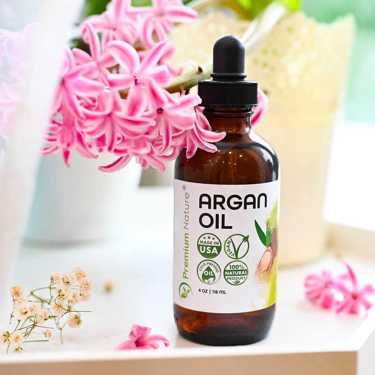 Premium Nature Argan Oil for frizz control helps manage curls naturally.