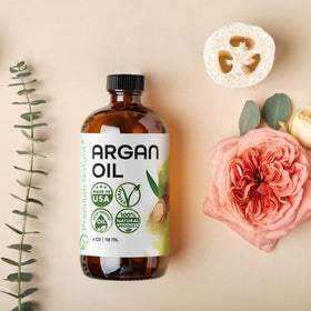 Premium Nature Argan Oil on hair demonstrates deep hydration for dry or damaged strands.