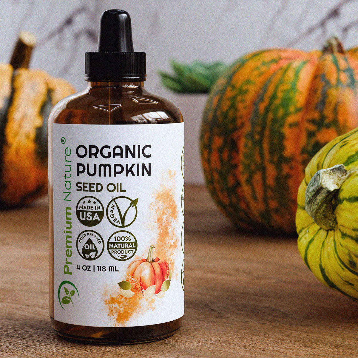 Premium Nature pumpkin seed oil applied to hair for natural shine.