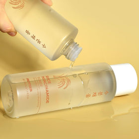 PRETTYSKIN Rice Extract Toner on a cotton pad ready for smooth skin refinement.