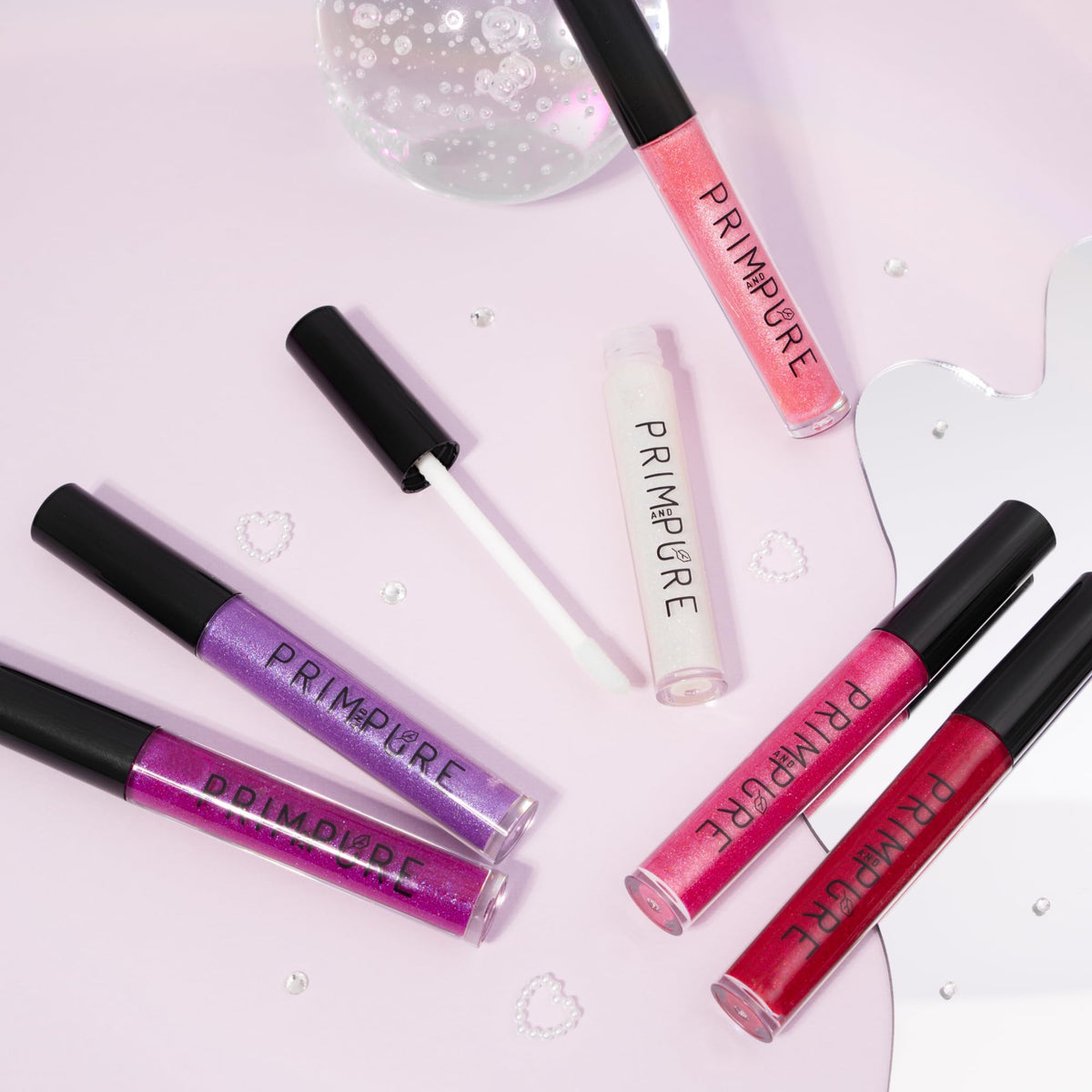 Prim and Pure Mineral Play Lip Gloss packaging on shelf, ready for gifting.