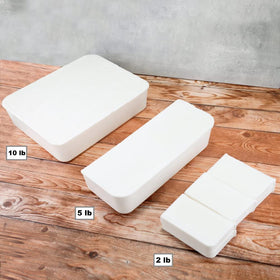 Primal Elements White Soap Base poured into molds to create personalized bars.