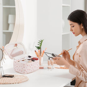 Prite carry-handle cosmetic bag for easy transport.