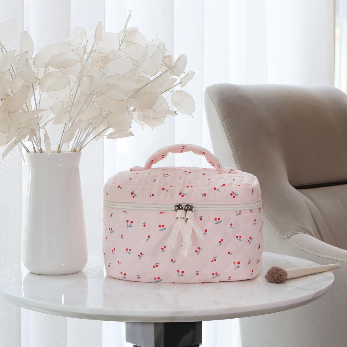 Prite makeup bag with dual zipper and gold hardware for easy access.