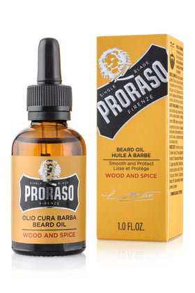 Proraso Wood and Spice beard oil bottle pouring for easy application.