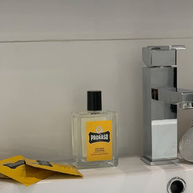 Proraso Wood and Spice bottle with vanilla-amber base for evening wear.