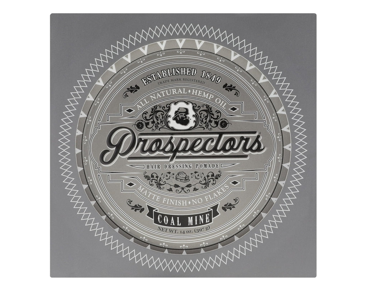 Hand applying PROSPECTORS Coal Mine Matte Clay for natural medium hold