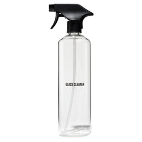 Public Goods empty glass spray bottle top view, minimalist design for quick cleaning tasks.