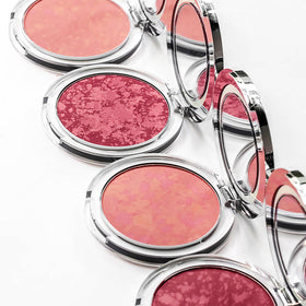Close-up of applying PÜR MINERALS Blushing Act with a brush for blending
