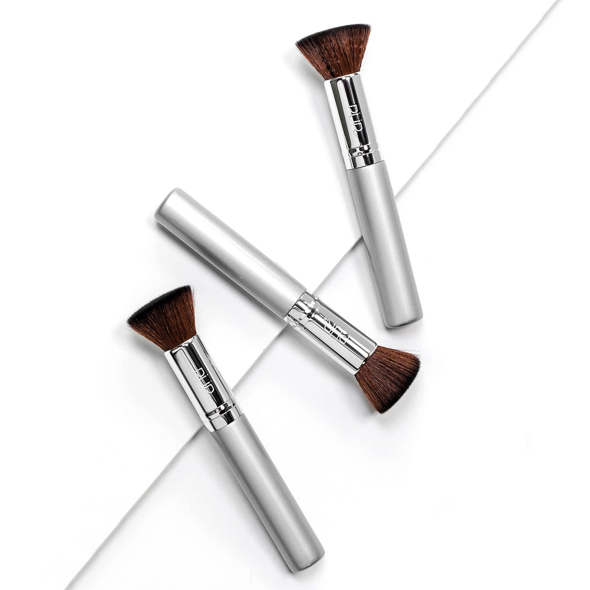 PÜR MINERALS Chisel Brush packaging shown for convenient storage.