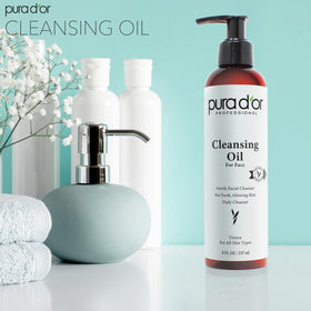 PURA D'OR cleansing oil pour showing easy dispense and luxurious texture